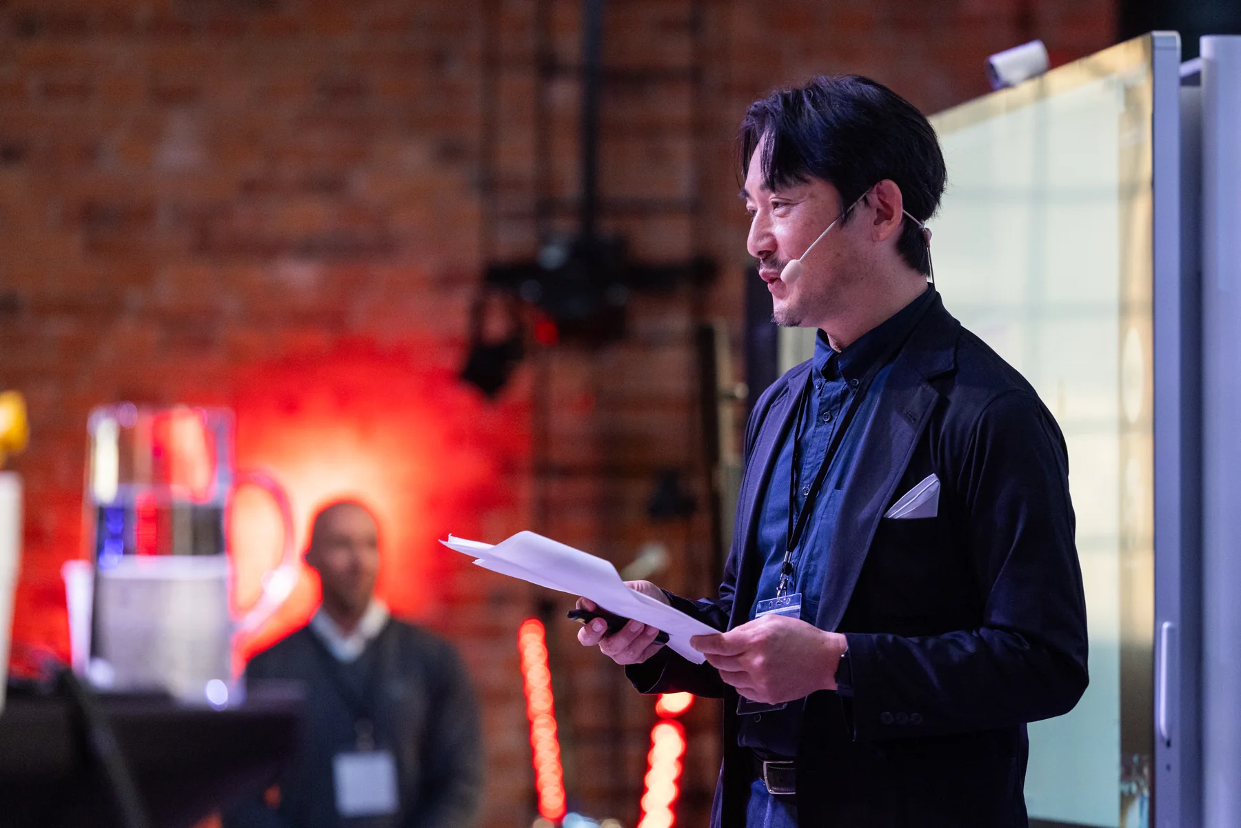 Kouji Miki speaking at an international event